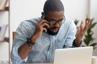 man talking on phone upset