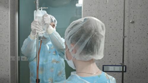 Nurses giving Intravenous injection