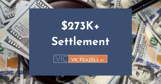 Strong wooden judge's gavel stands on scattered dollar bills with the words "$273K+ Settlement" and logo of the Law Offices of Vic Feazell, P.C.