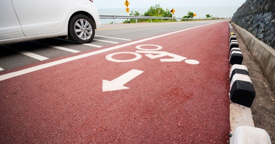 bicycle lane next to a highway