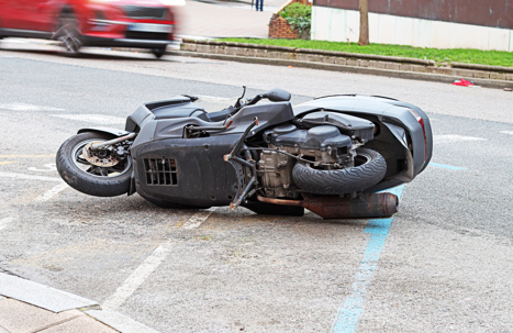 A motorcycle lying on a street.