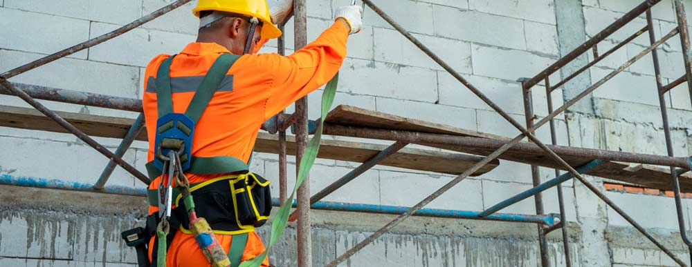 Construction working on scaffolds.