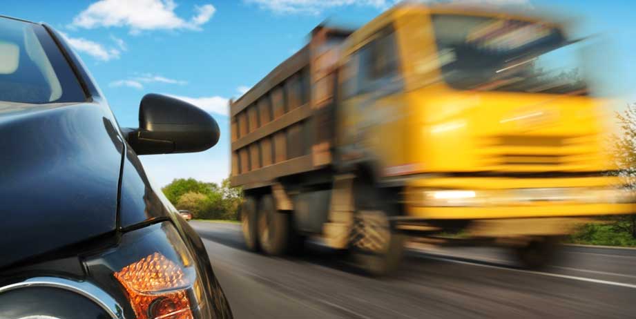 A truck going fast on the road