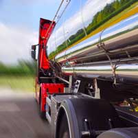 a truck riding the road